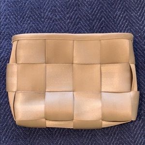 Gold seatbelt clutch